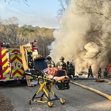 Firefighters work at the scene of a structure fire