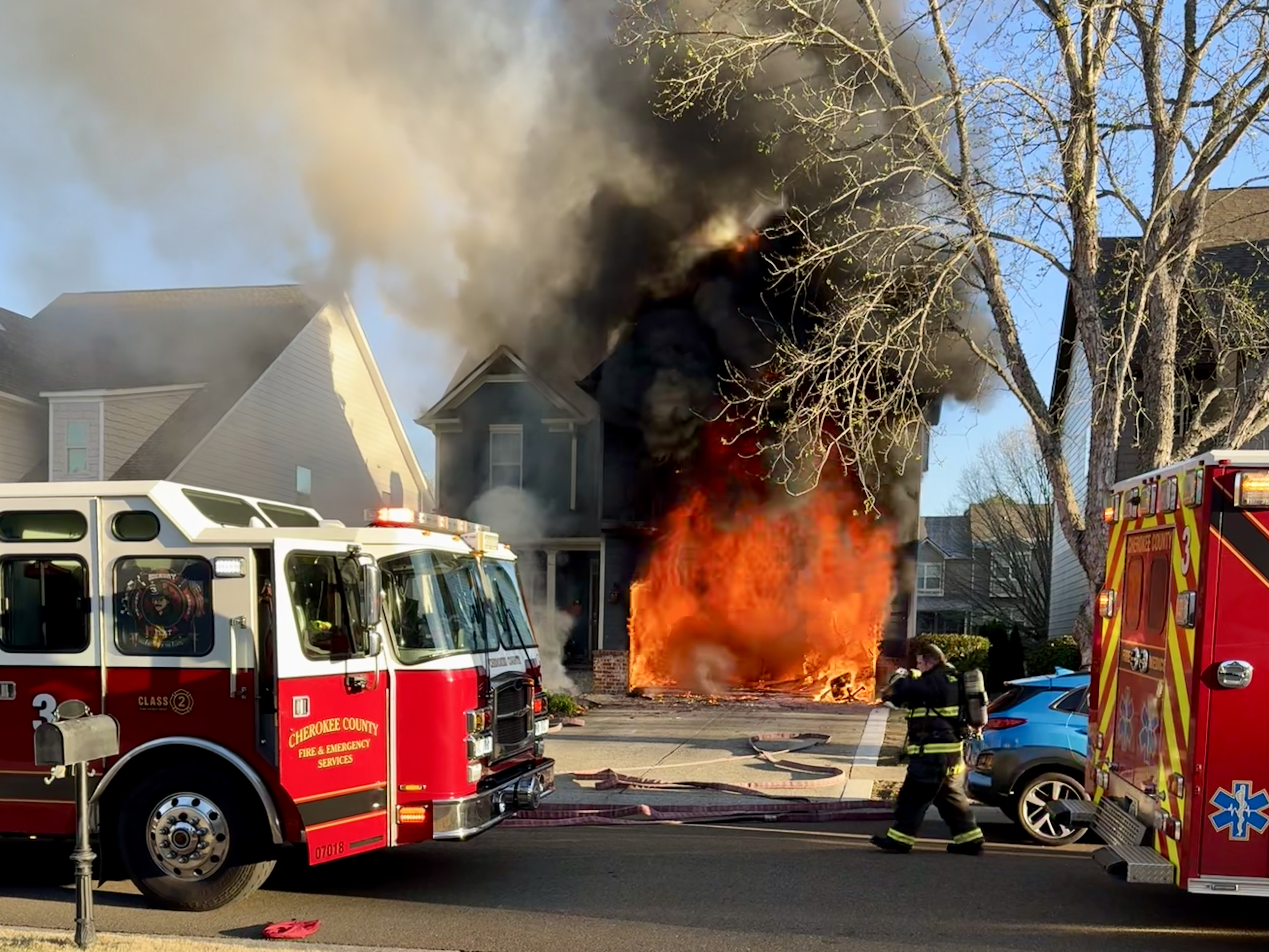 Firefighters working on scene of a structure fire on Royal Crescent Terrace. 